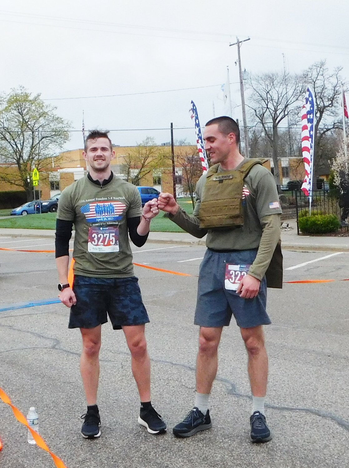 Tyler Sobleskey, right, and Phillip Hale share a fist-bump moment of congratulations after crossing the finish line first and second, respectively. They crossed completed the race just 10 seconds apart, and were followed in short order by Justice Walraven just 57.4 seconds later.
